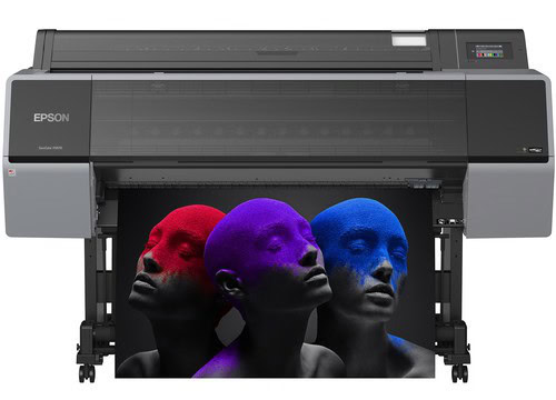 High-quality large format Epson printer printing vivid colored 3D mannequin head images for signs, banners, and custom apparel at Graphic Impact.