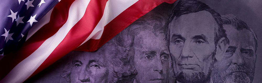 United States dollar bills with American flag draped over, symbolizing patriotism and finance.