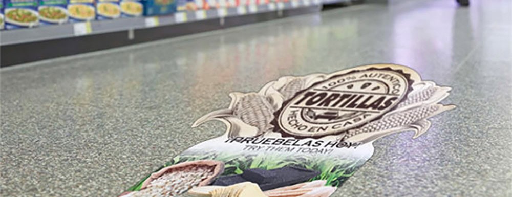Vibrant custom tortilla chip bag or label on a countertop, showcasing detailed graphics and logo design, ideal for branding or product packaging in a food retail setting.