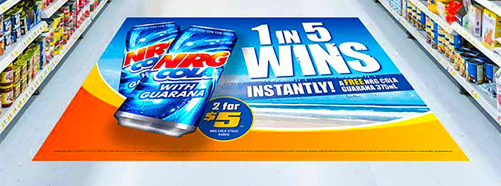 NRG COOLER advertisement floor graphic showcasing "1 in 5 wins instantly" promotion in a retail store aisle.