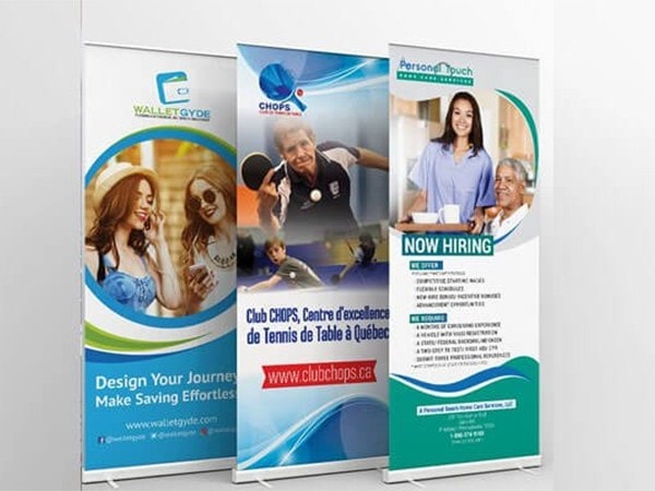 Colorful retractable banners promoting various services including wallet design, tennis club, and hiring. Perfect for marketing events and storefronts. Vibrant graphics attract attention and convey professional branding.
