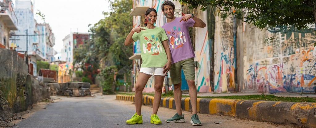 Perfect Custom Shirt | Design It Yourself 1 Vibrant graffiti wall with happy young adults posing casually on a city street Art-motif t-shirts worn by smiling friends showcasing streetwear style and urban art backdrop Enhancing urban fashion, street art, and casual wear appeal for promotional content relevance.
