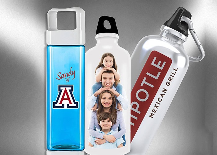Blue water bottle with Arizona logo and "Sandy" text, smiling family photo printed on a white bottle, large metallic chipotle hot sauce bottle with "Mexican Grill" label, customizable signs and apparel printing services.