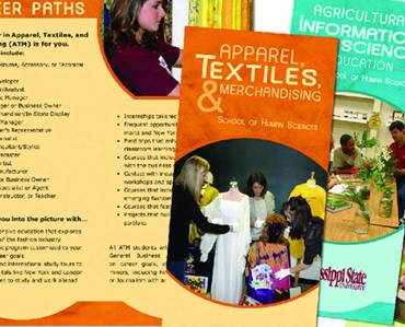 Vibrant display of school signs and banners for apparel, textiles, and merchandising at Graphic Impact, showcasing custom engraving, apparel printing, and signage solutions for educational and business needs.