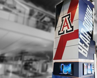 Vibrant Arizona Wildcats branded sign display showcasing school colors and logo, perfect for sports venues, events, or campus advertising.