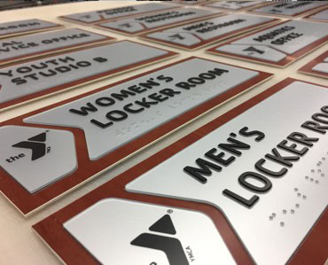 High-quality custom signs and banners for events, businesses, and personal use, showcasing engraving, apparel, and signage solutions at Graphic Impact.