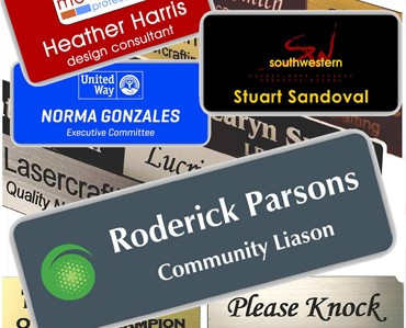A variety of custom signs and banners for branding, business promotion, and personal events showcasing Graphic Impact's expert engraving and apparel services.