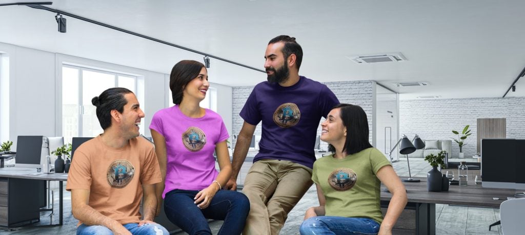 Bitcoin-themed apparel worn by diverse coworkers in modern office setting, showcasing custom t-shirts with Bitcoin logo, highlighting branding, team spirit, and promotional merchandise.