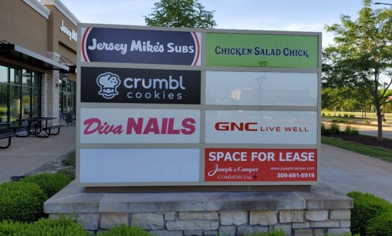 Jersey Mike's Subs, Crumbl Cookies, Diva Nails, GNC, and a leasing sign for Joseph & Camper on a commercial retail directory sign outside a shopping center.