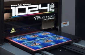 A close-up of a state-of-the-art digital printer producing colorful circuit boards, highlighting high-resolution textile LED printing capabilities for custom signs, banners, and apparel.