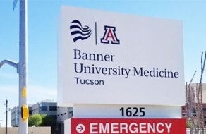 Professional signage for University Medicine in Tucson, featuring banners and emergency access information demonstrating high-quality printing and engraving services.