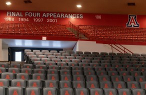 Final four appearances display on red wall above stadium seating with Arizona Wildcats logo.